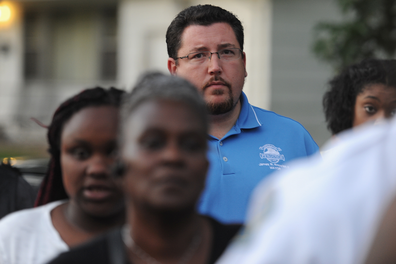 Ferguson, Mo., Mayor James Knowles looks on during a candlelight vigil Aug. 20, 2015, held in honor of Jamyla Bolden, a 9-year-old Ferguson girl who was killed while doing her homework after authorities say she was struck by a stray bullet that entered her home. Michael B. Thomas/ Getty Images